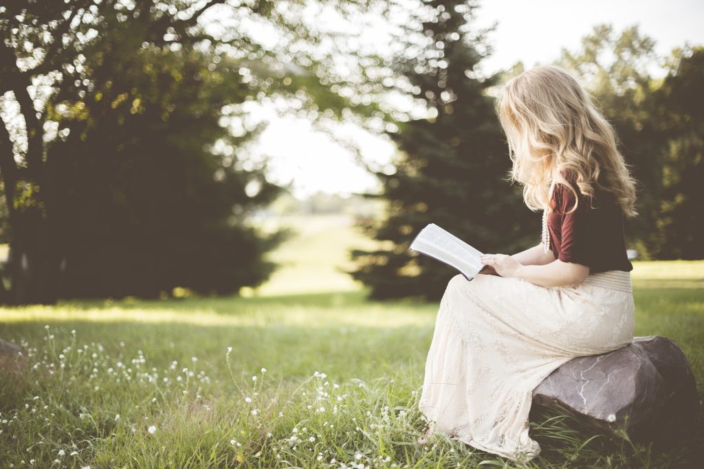 girl reading in nature