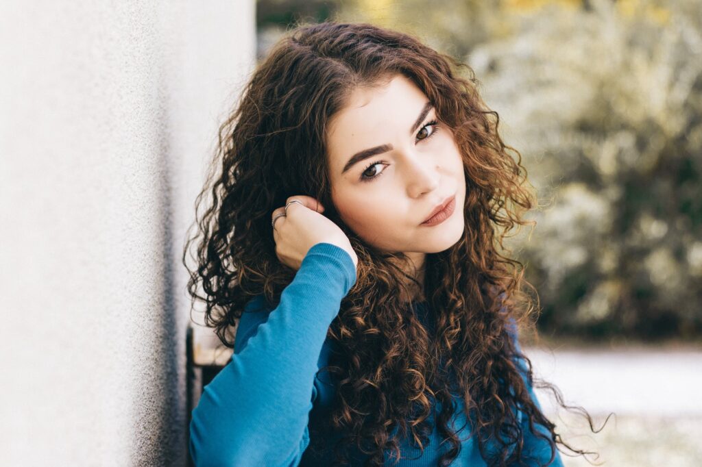 woman wearing blue long sleeved shirt