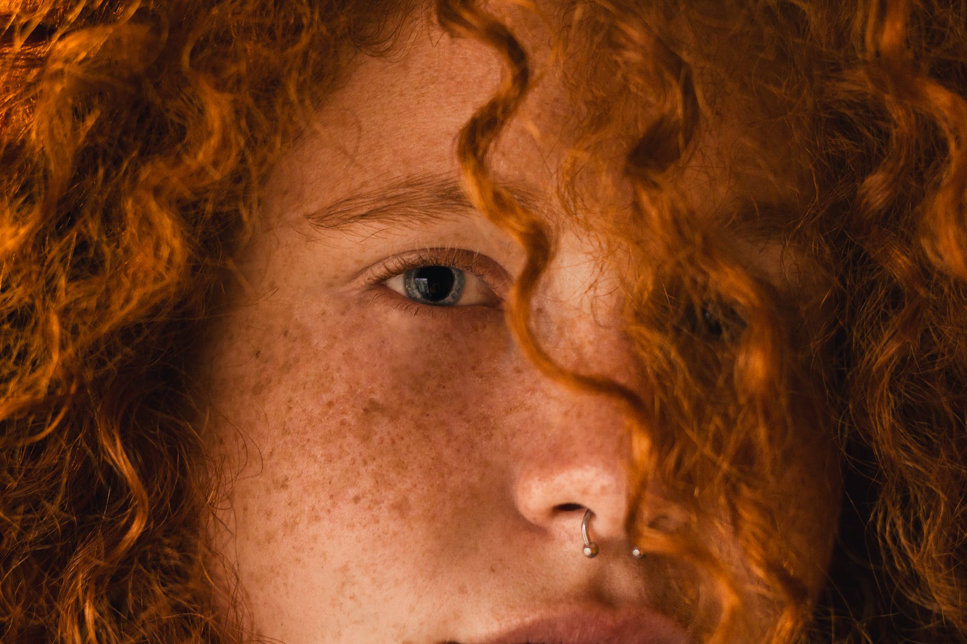 close up photo of person with curly hair