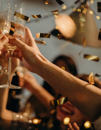 people toasting wine glasses