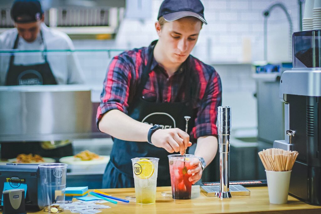 man stirring a drink